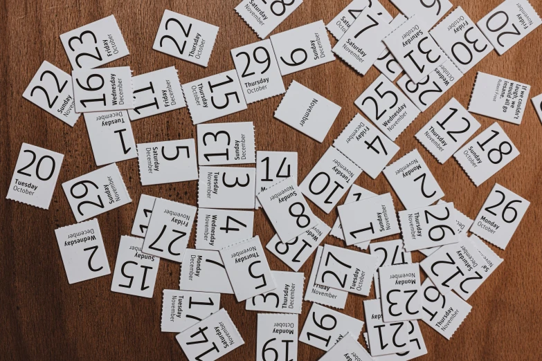 a pile of black and white cut outs with numbers
