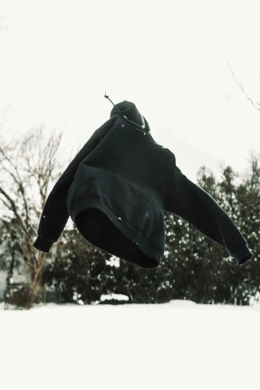 a person jumping a snowboard in the air