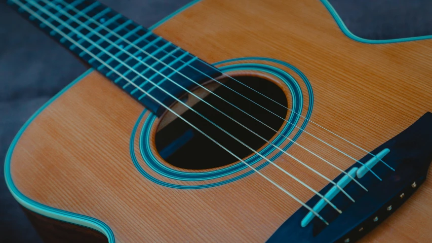 a close up of the strings on an acoustic guitar