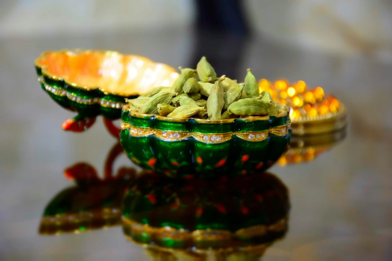 two bowls sitting on top of a glass table covered in flowers