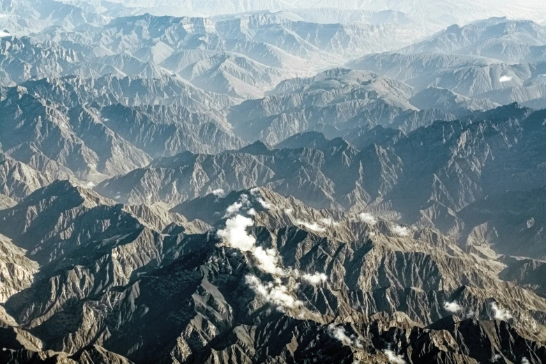 the top view from an airplane flying over a mountainous area