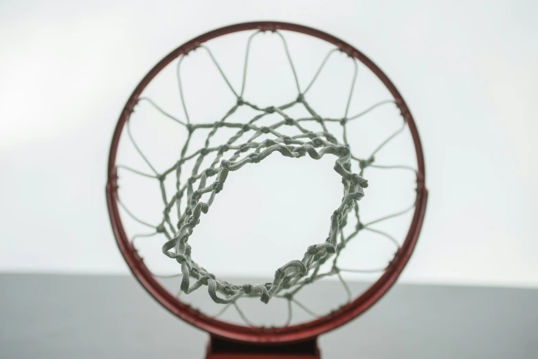 the front side of a basketball hoop in a room