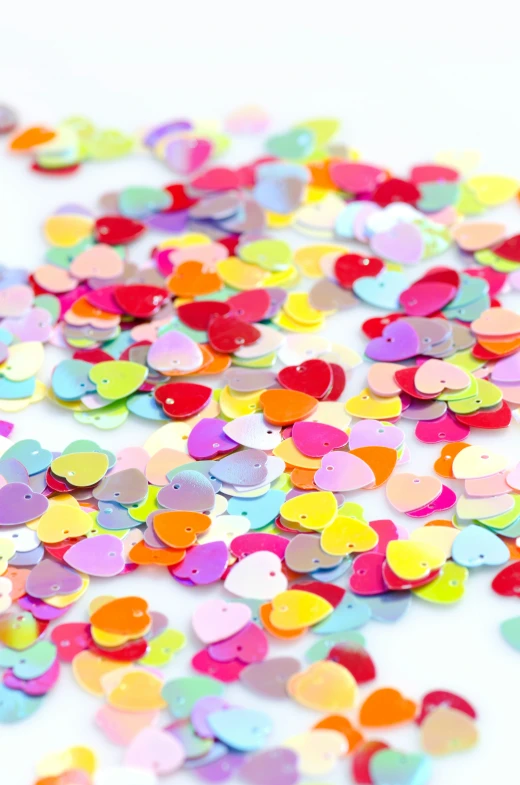 a pile of small confetti on a table