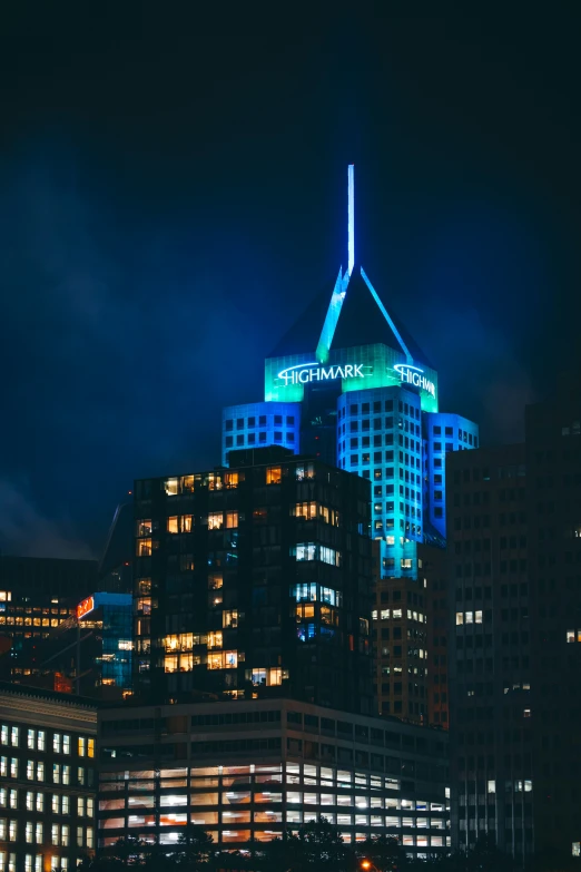 view of the illuminated tower and surrounding buildings at night