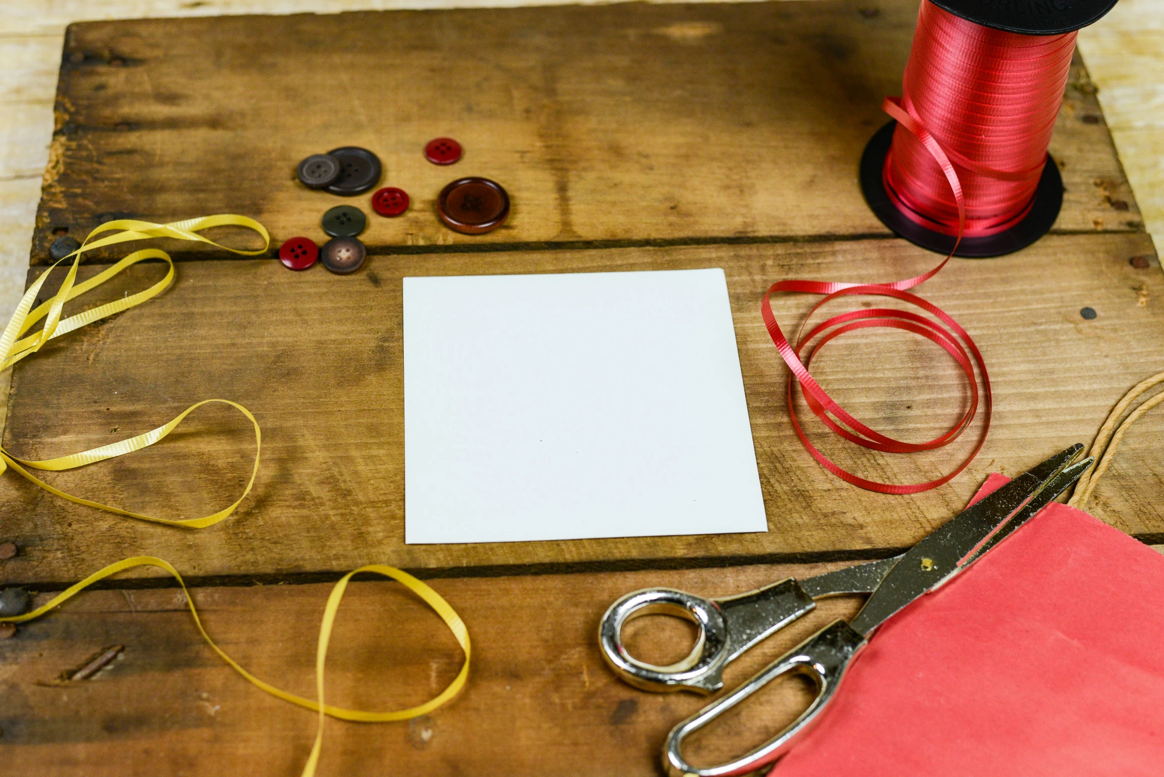 a table with several different items and thread