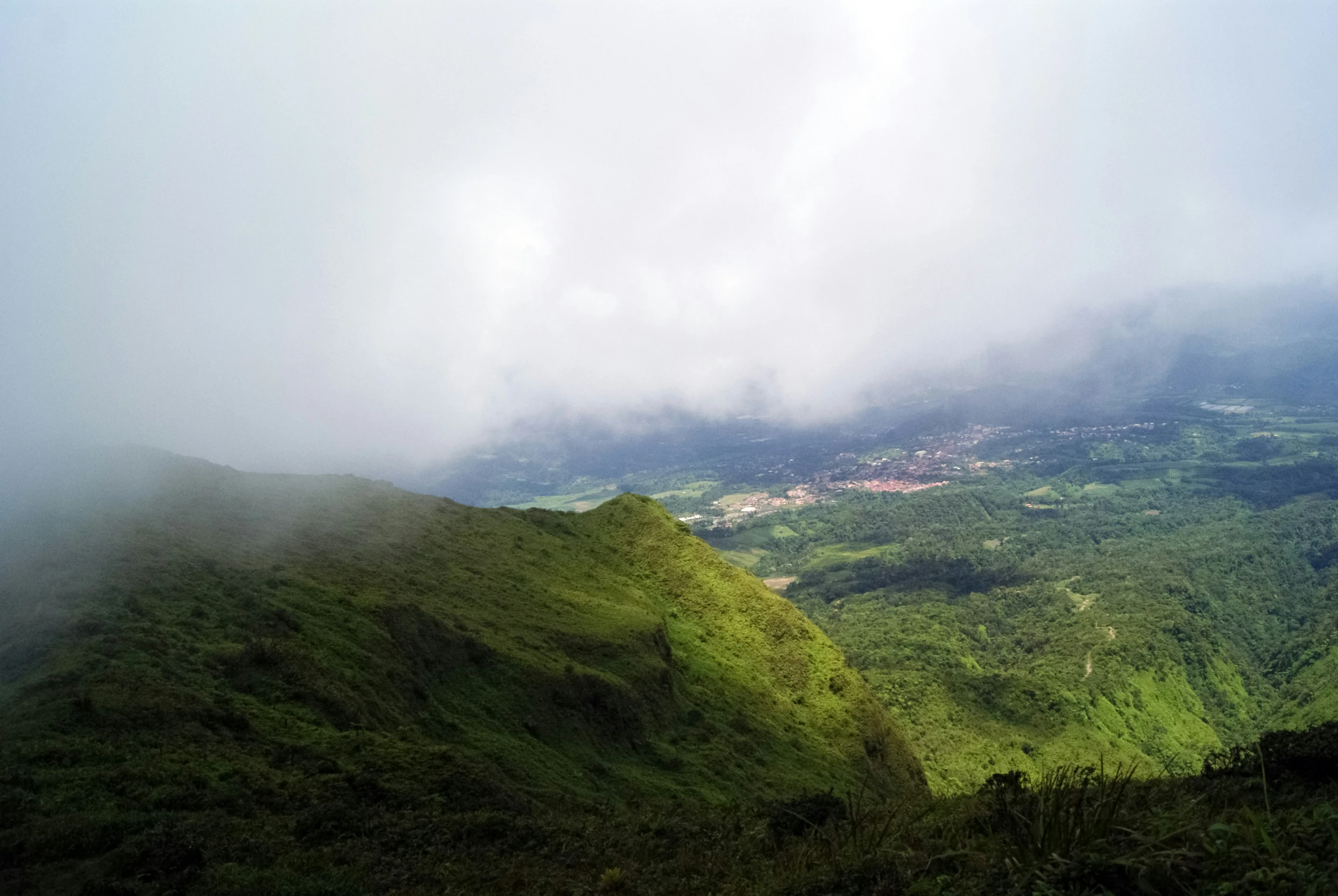 a distant view of an area with hills and clouds