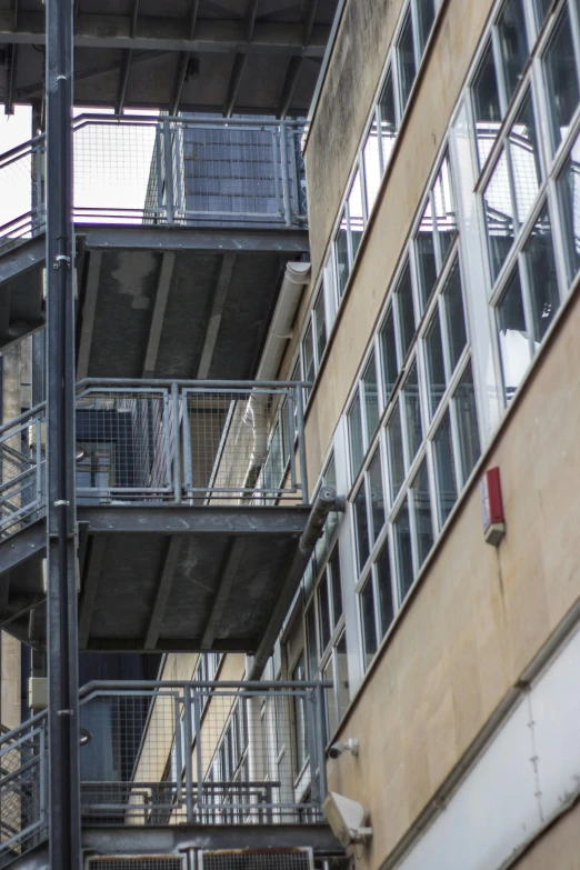 stairs outside a building, with railings running up it