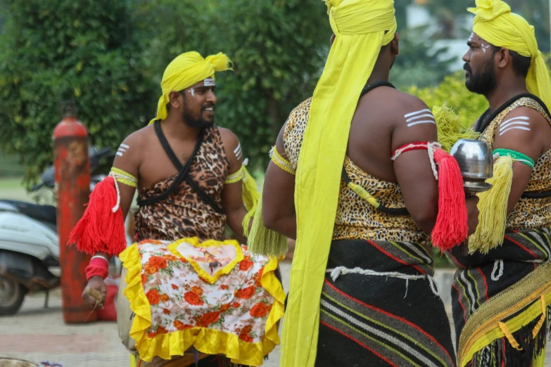 two men are dressed up with bright yellow hair