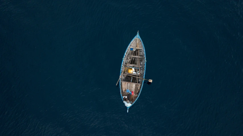 there is a boat on the water with people inside