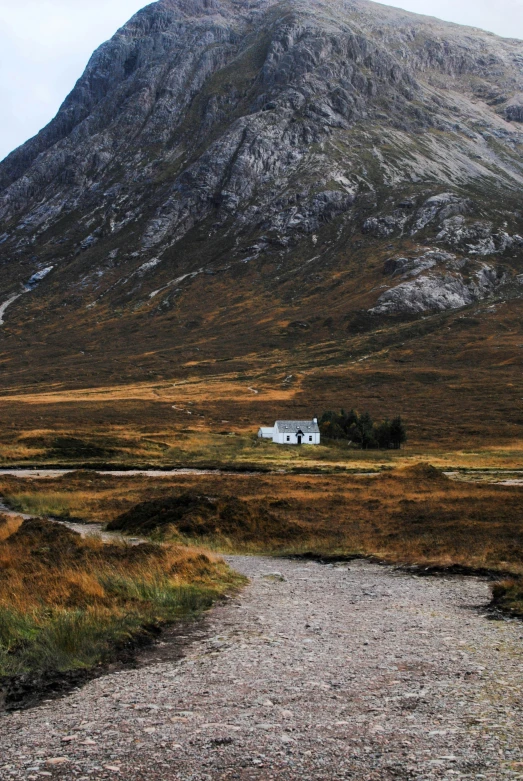 a road going through an area with a mountain behind it