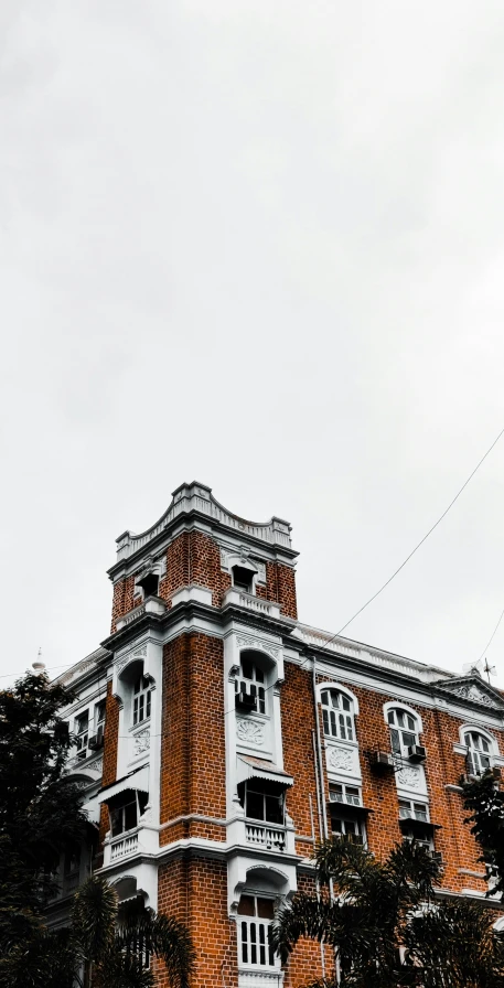 an old building has many windows that look like it has been painted red