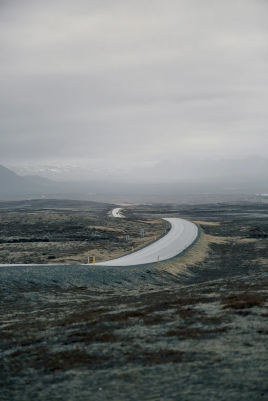 a road sits on one side of the field