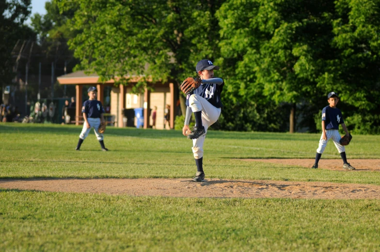 two baseball players are playing together at the field