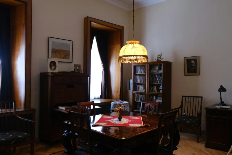 a room that has a desk with books