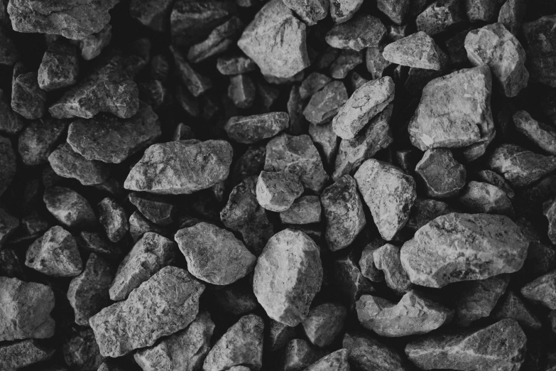 black and white pograph of rocks on a rock wall