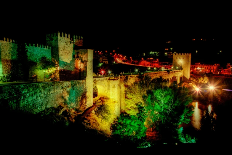 a building with lights on top in the city at night