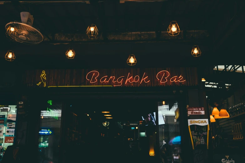 neon sign in an empty restaurant with people