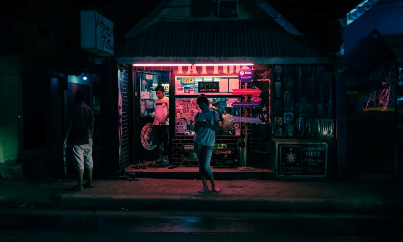 the girl stands in front of the street vendor's stall