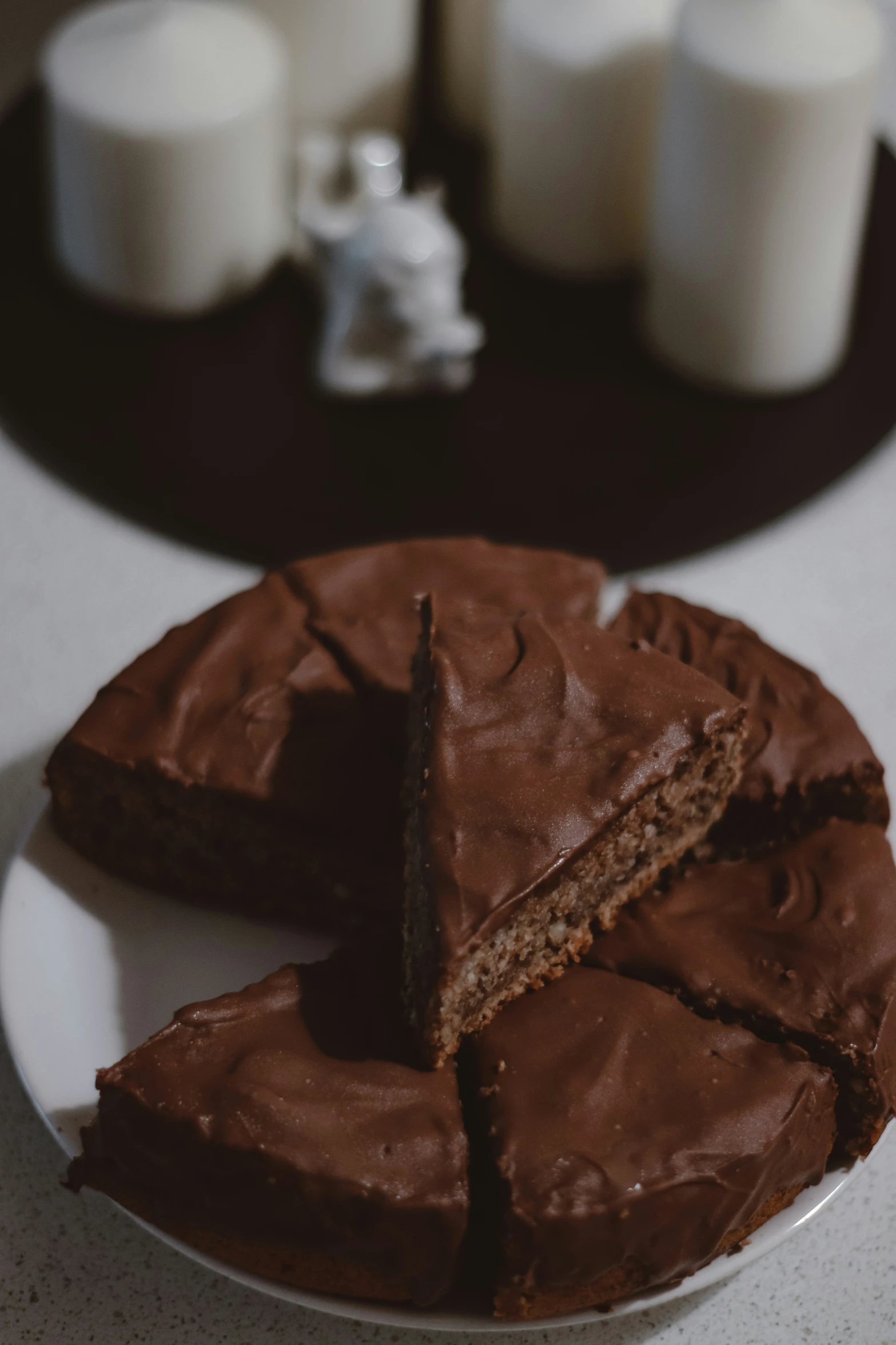 a piece of cake sitting on top of a plate with two pieces cut