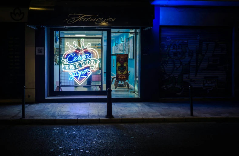a lighted shop front of a building