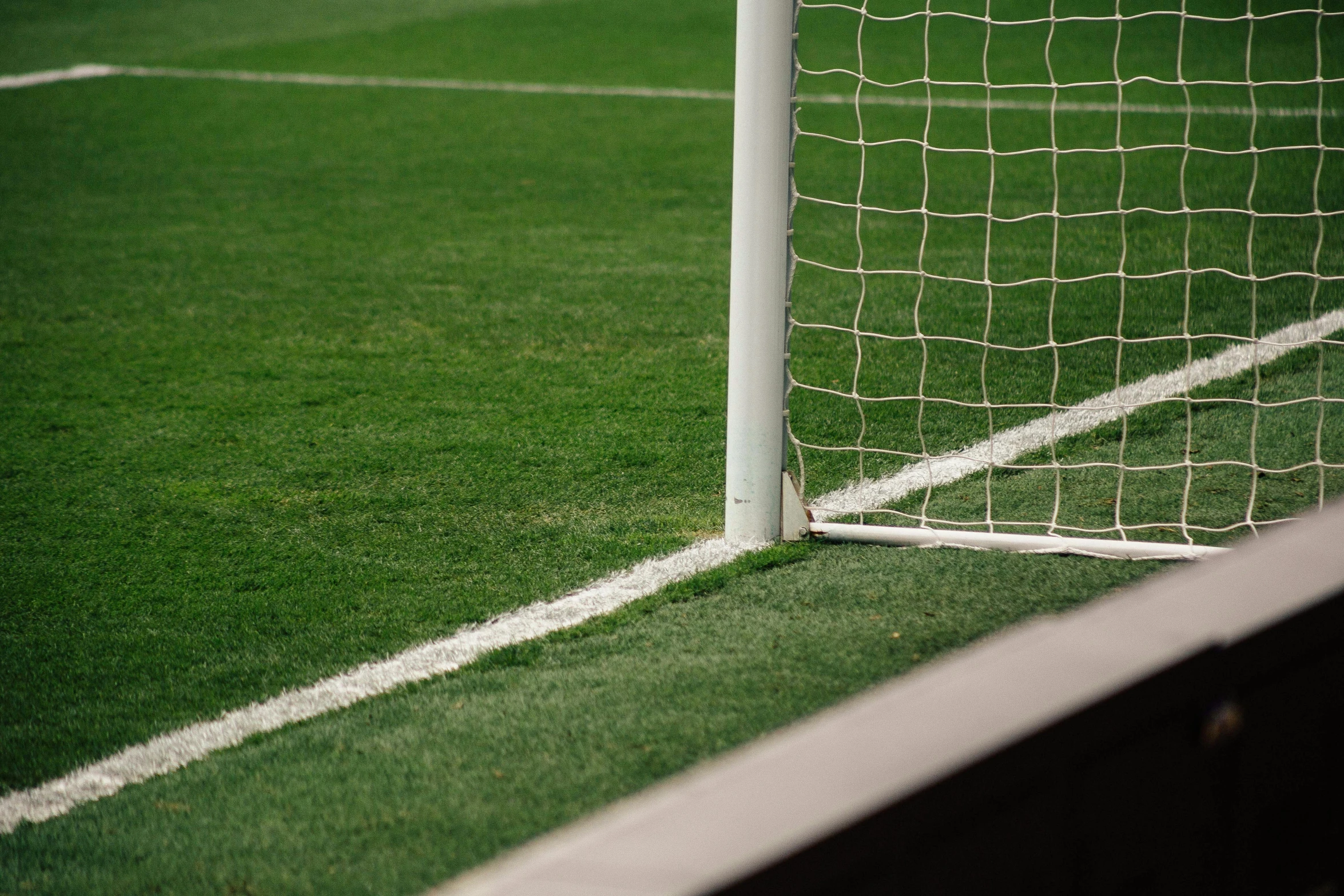 a close up of the corner lines of a soccer field