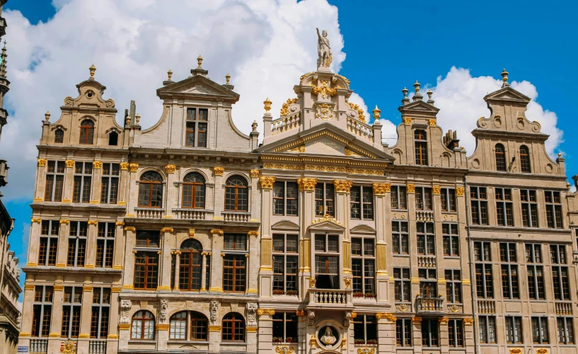 an ornate building stands with many windows