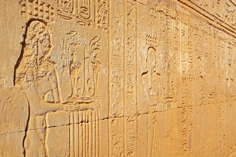 the carvings at the side of an ancient building