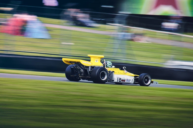 a speed racing car speeding down a track