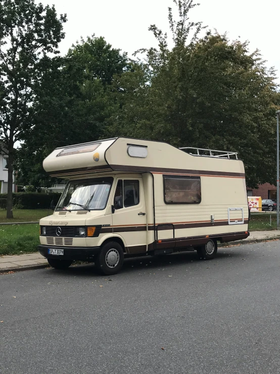 an rv parked on the side of a street