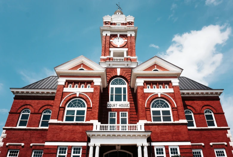 a clock tower on top of a building with arched windows