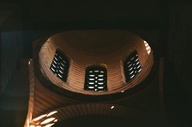 the top view of a clock tower with lights on