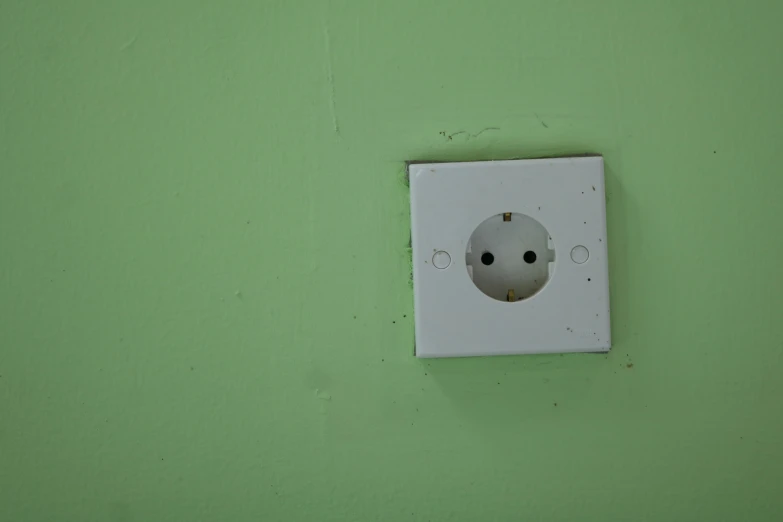 a light switch sitting on the side of a wall