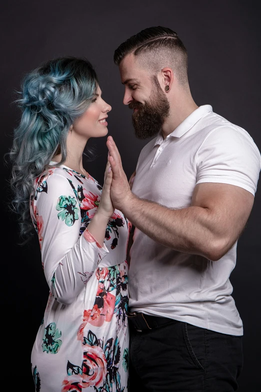 a man and a woman making funny faces while posing together