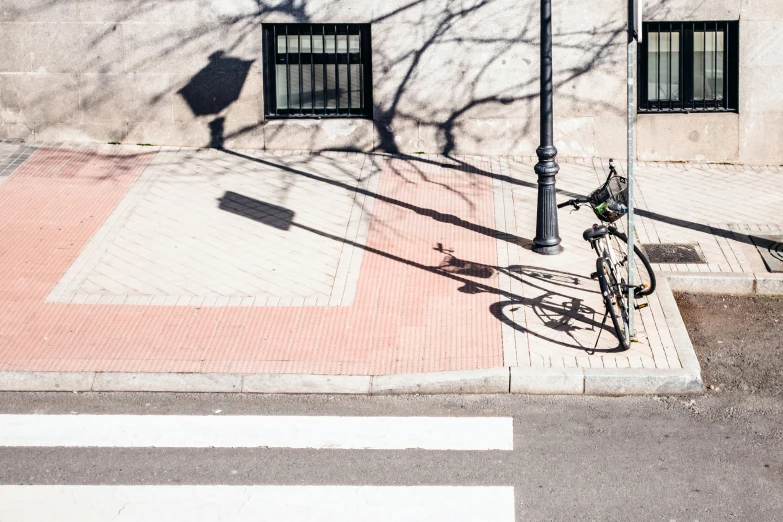 the bike is  up to the light post