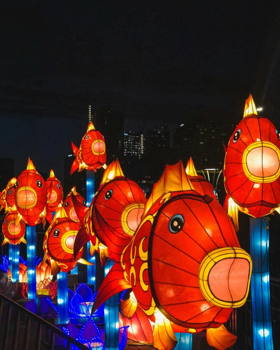 large red fish lanterns are set on display for a festival