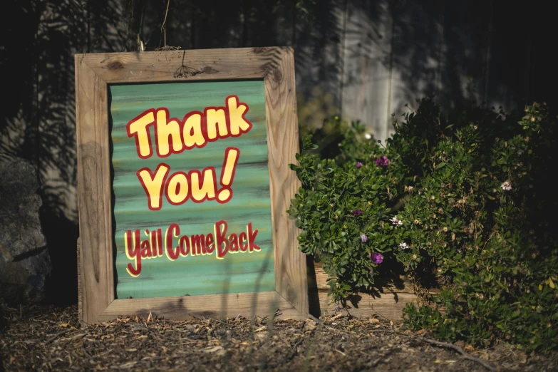 the sign says thank you yell come back on the front
