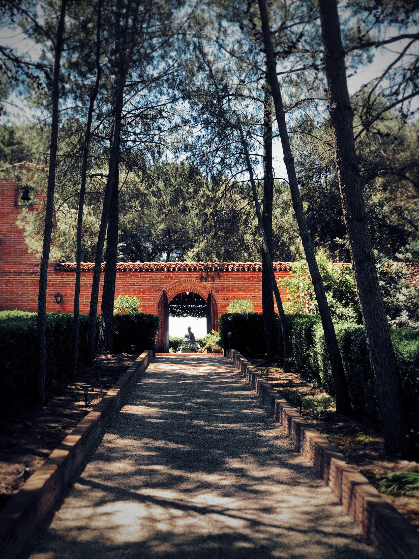 this po shows an archway leading to trees