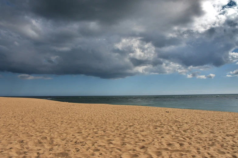 some big dark clouds over the beach