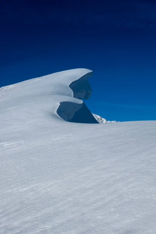 a snow skier that is standing in the snow