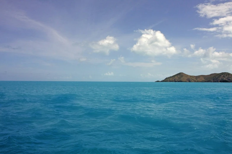 the sea with clear blue water and two islands