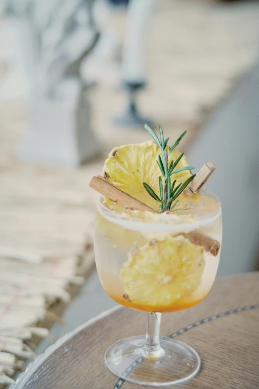 a glass filled with liquid on top of a table