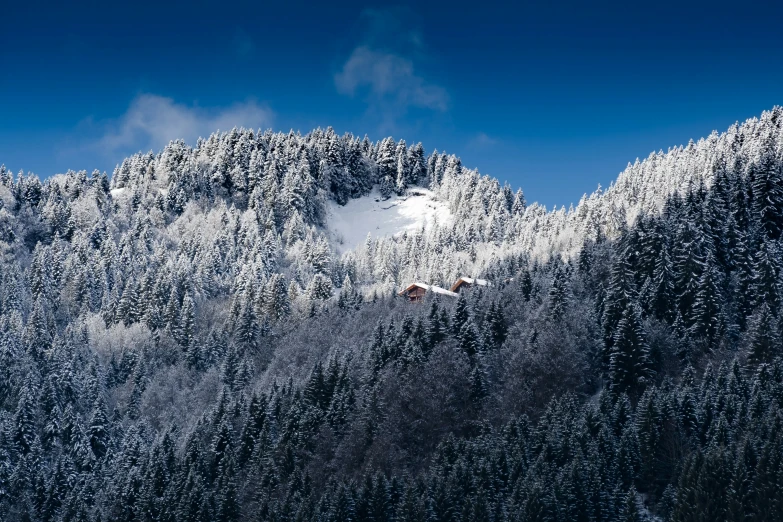 a mountain is covered with snow in the winter