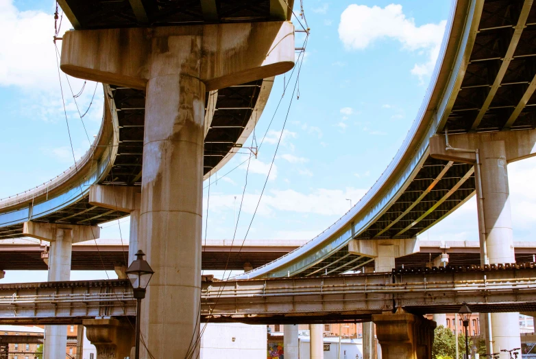 a row of metal traffic pillars on a bridge