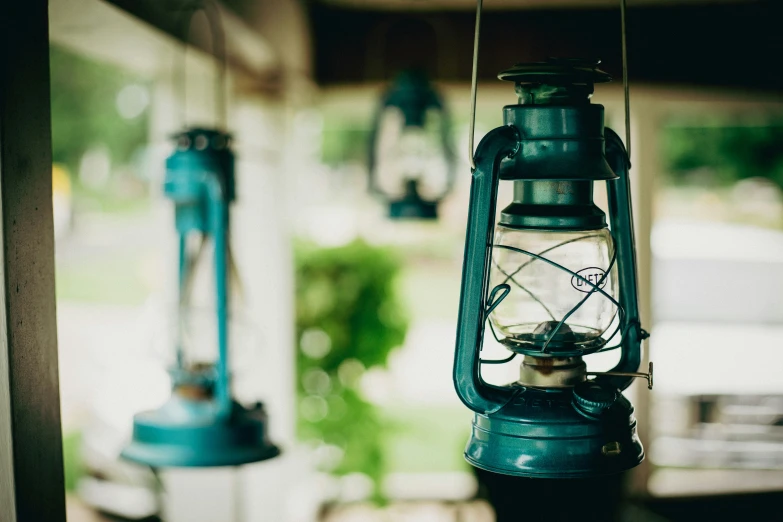 a lantern and light hanging from a building