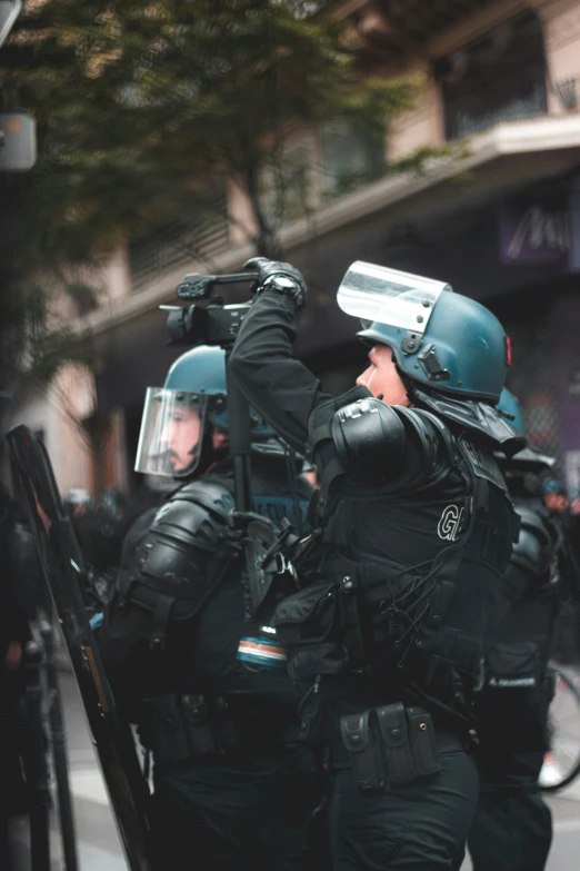 a police officer being escorted down the street by a policeman