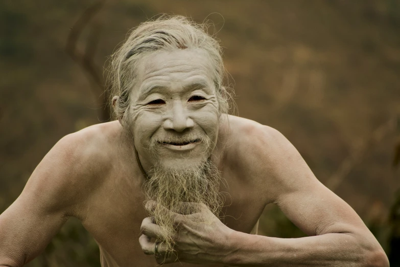 a man with a fake beard and white painted face