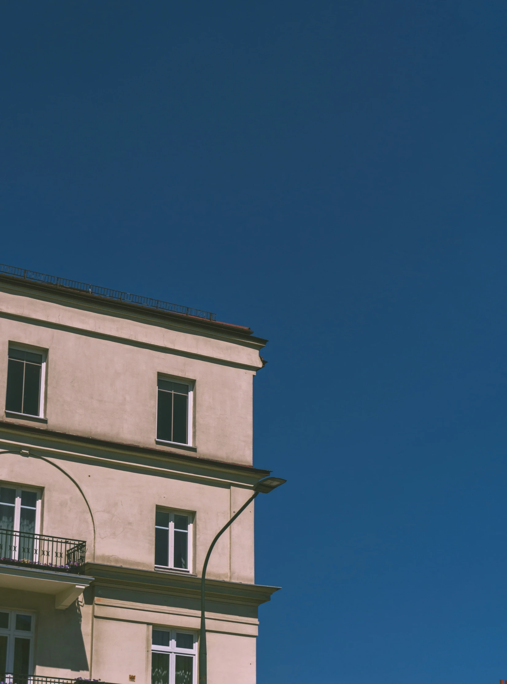 an image of an apartment building in the sun