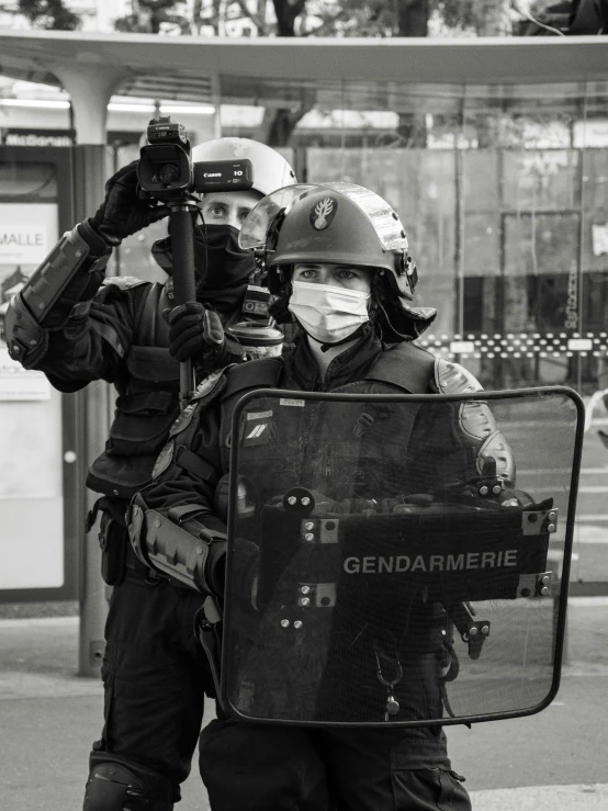 black and white pograph of two soldiers with a camera