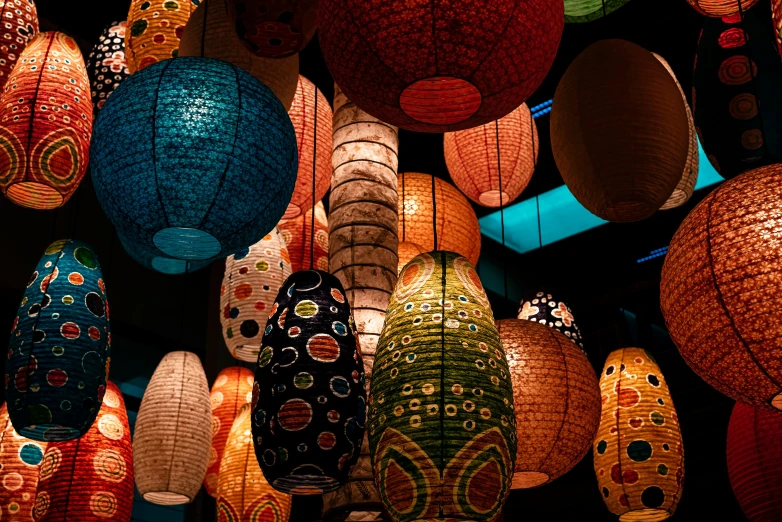 many lit up lanterns in the dark of night