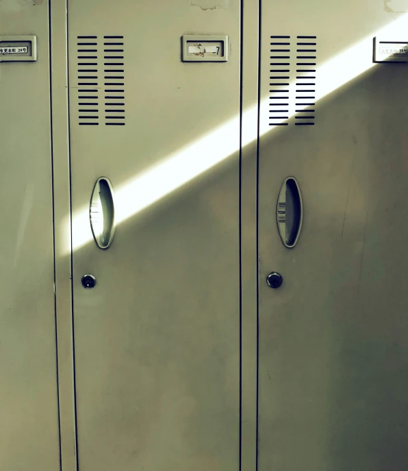 a group of metal lockers are shown on a wall